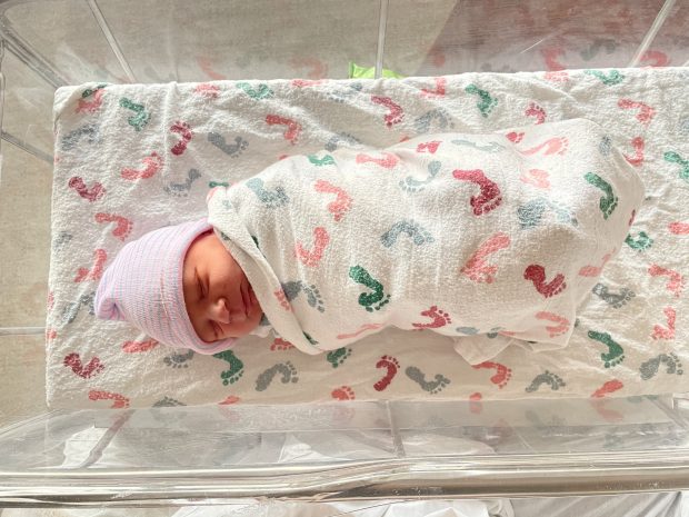 baby at hospital wrapped in blankets